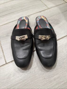 Hermes Slip-On Mules with Silver Hardware has  sticker on kelly lock